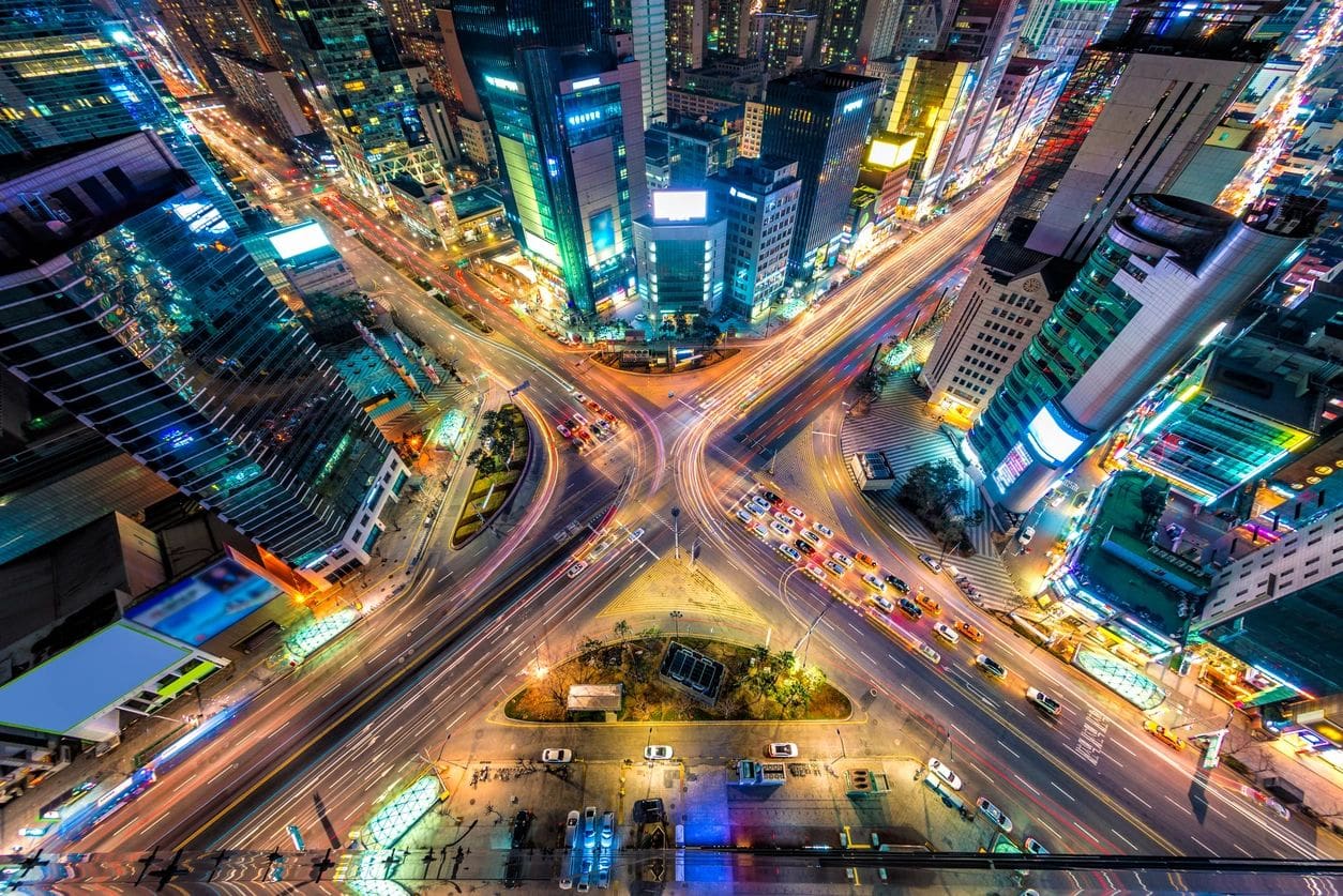 Looking down on a major interstection at night in Seoul, South Korea.